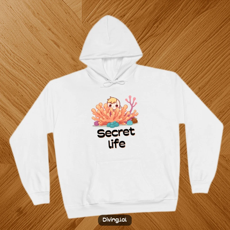 Funny Curious Reef Hoodie: Tiny character peeks from behind coral reef, curious eyes, a cozy funny gift.